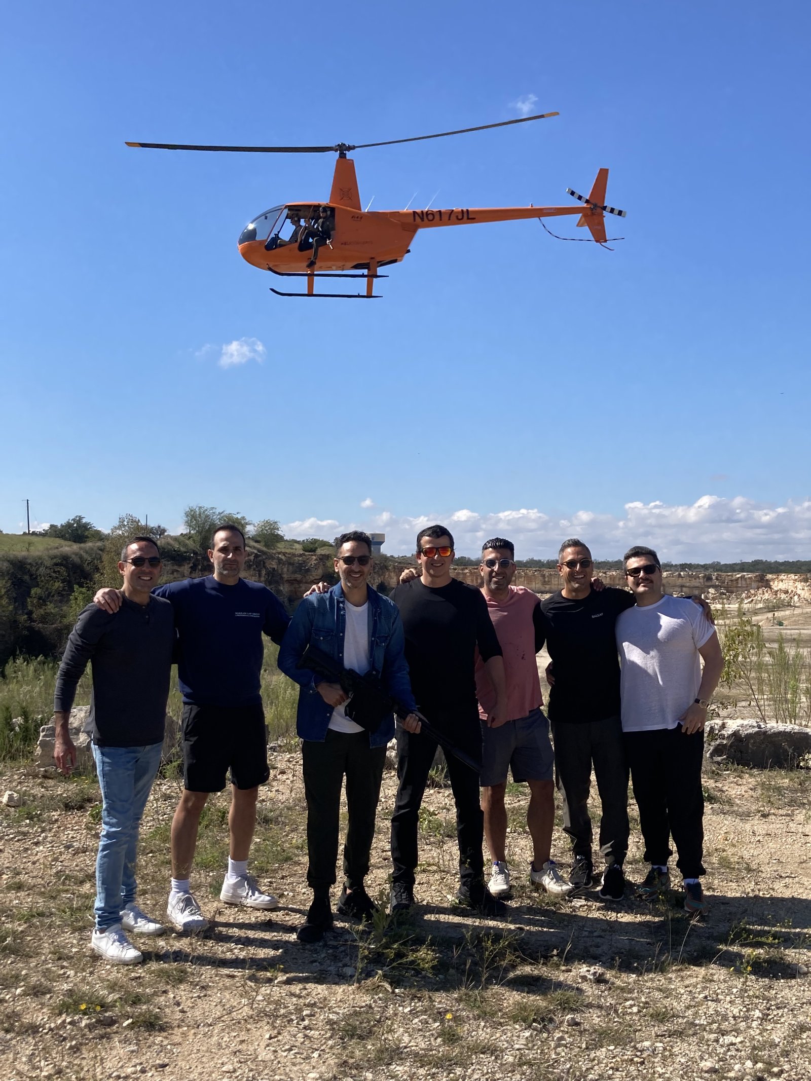 Bachelor party group with helicopter