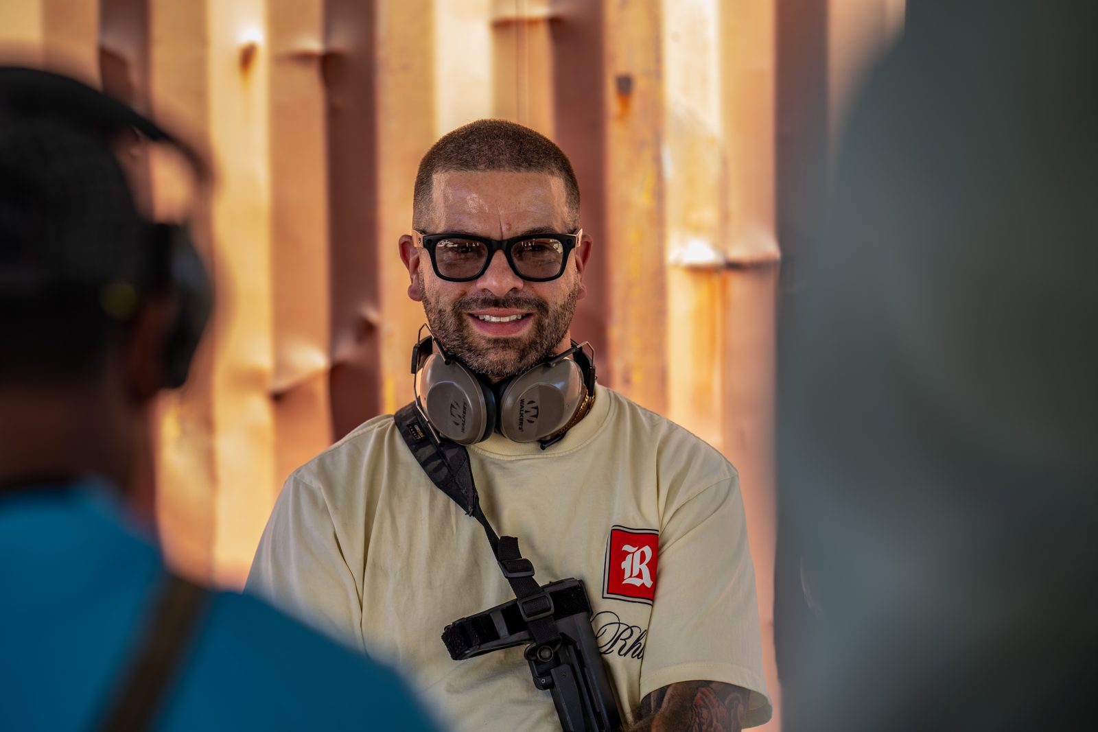 Bachelor party guest smiling at Austin shooting range