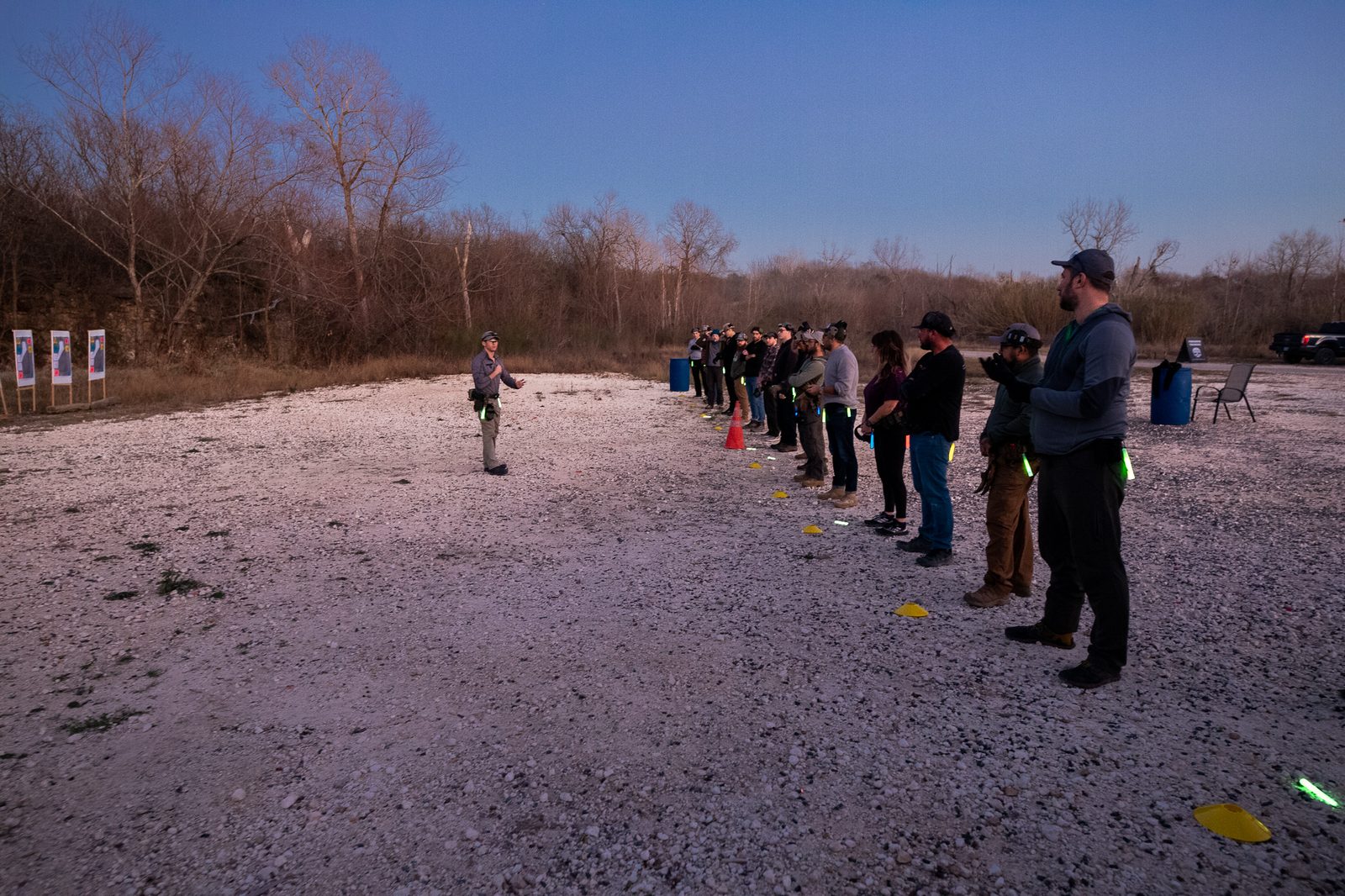 Combat Club members lined up on the private outdoor range as Ron briefs the Saturday session