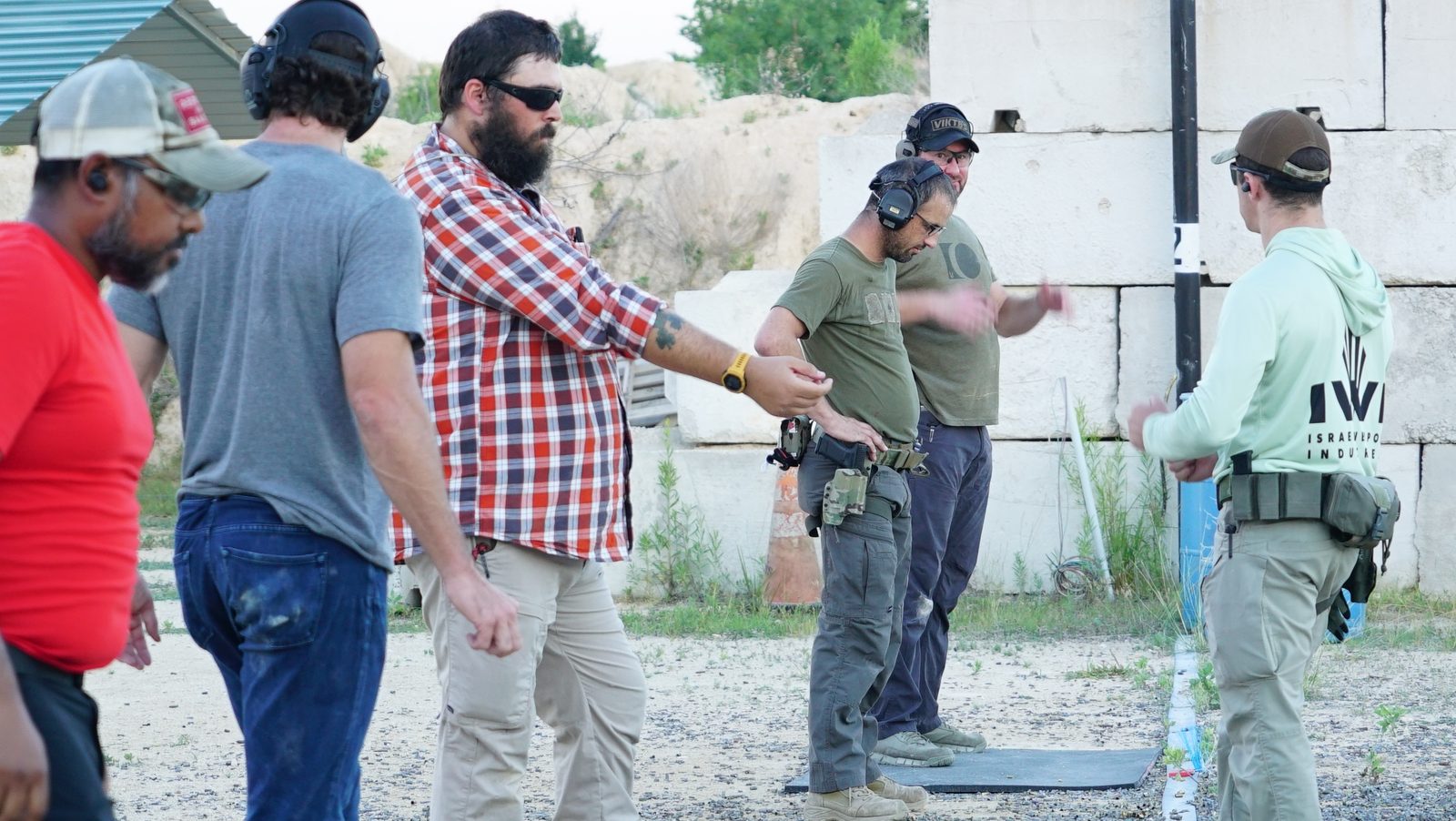 Corporate team running drills at Tactical Fitness Austin outdoor range in Austin