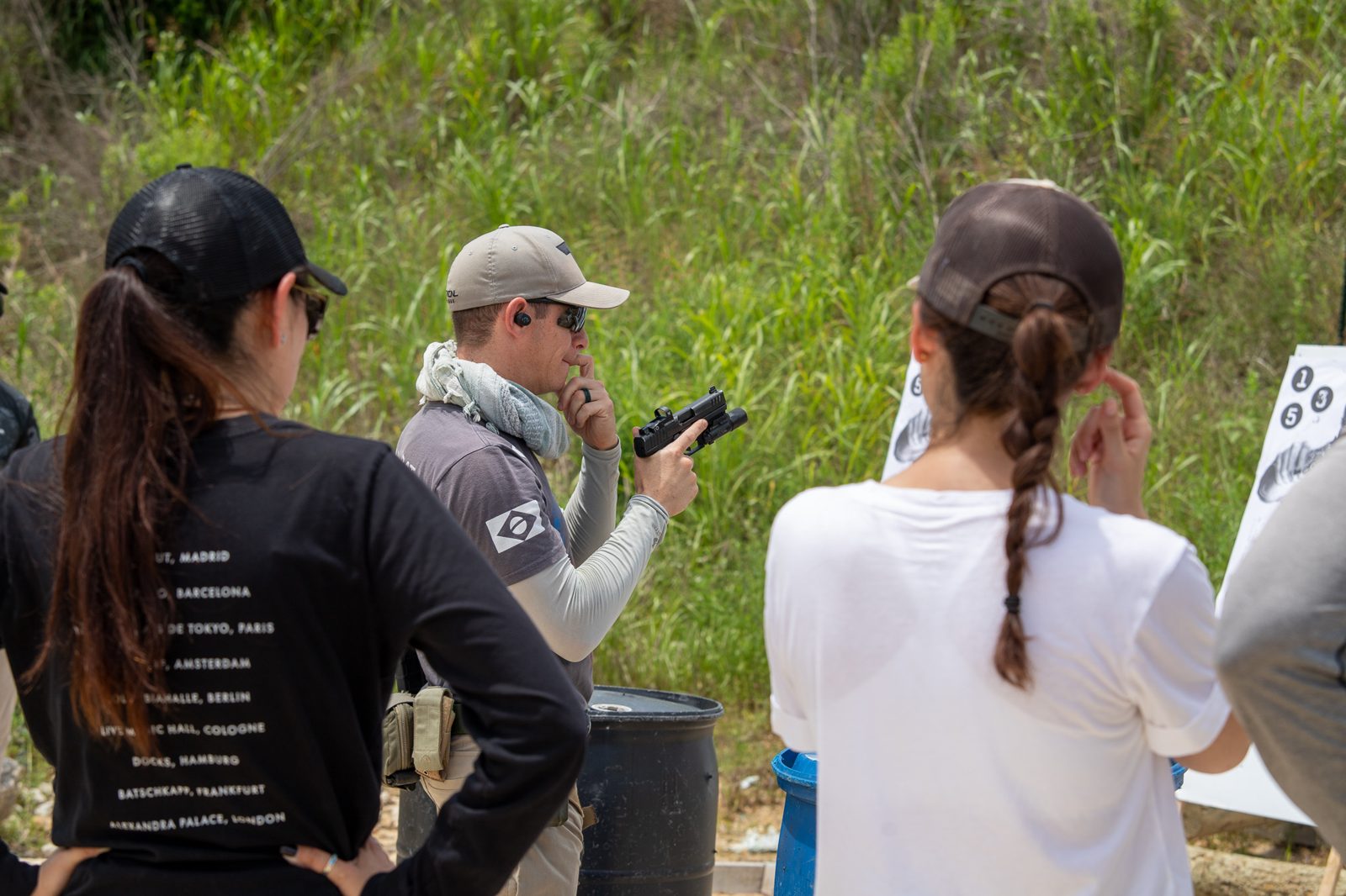 Instructor briefing corporate group at Tactical Fitness Austin private range
