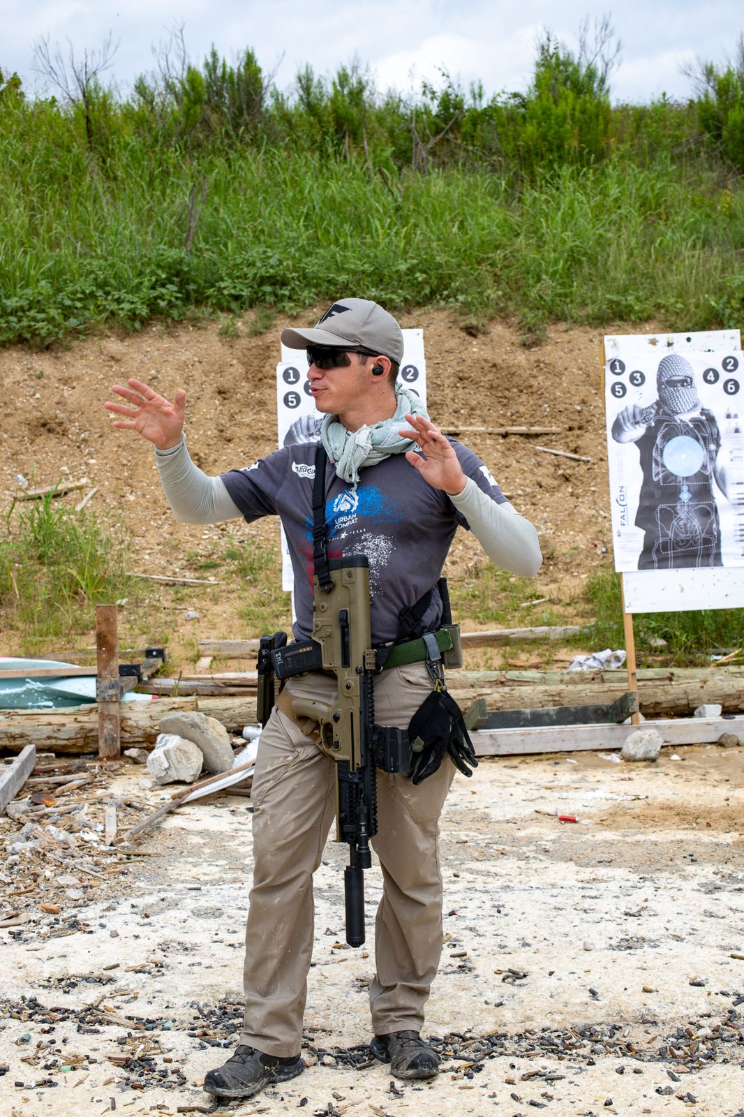 Expert instructor demonstrating rifle technique at corporate leadership offsite Austin