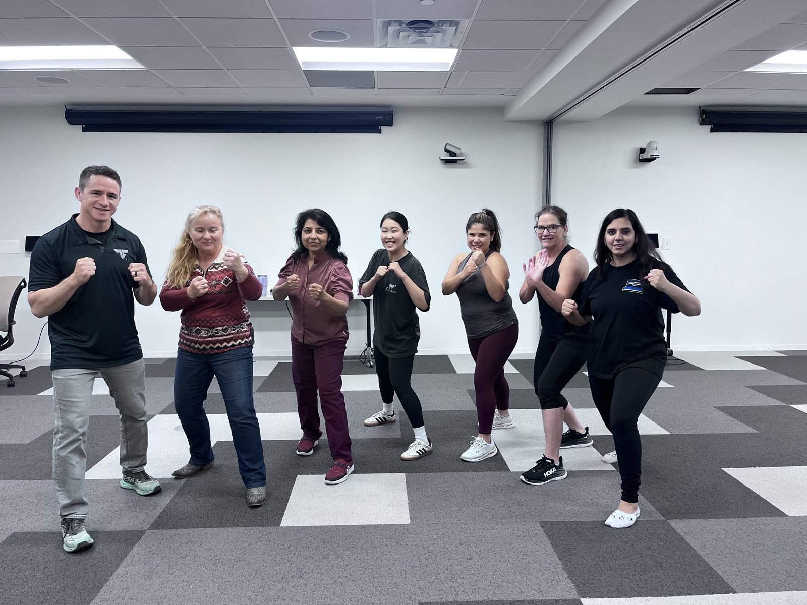 Corporate team completing self-defense training at Tactical Fitness Austin
