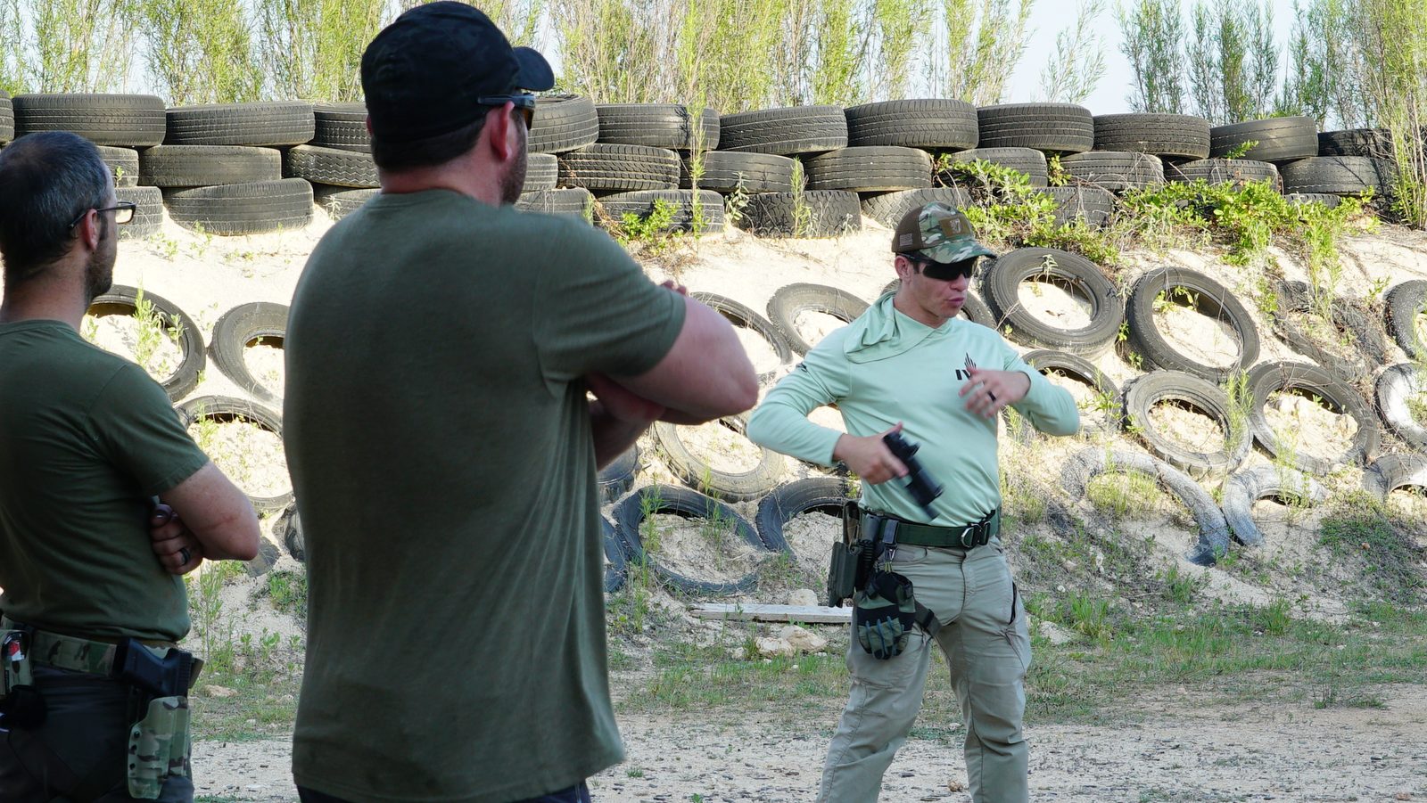 TFA instructor demonstrating pistol technique during private firearms training Austin