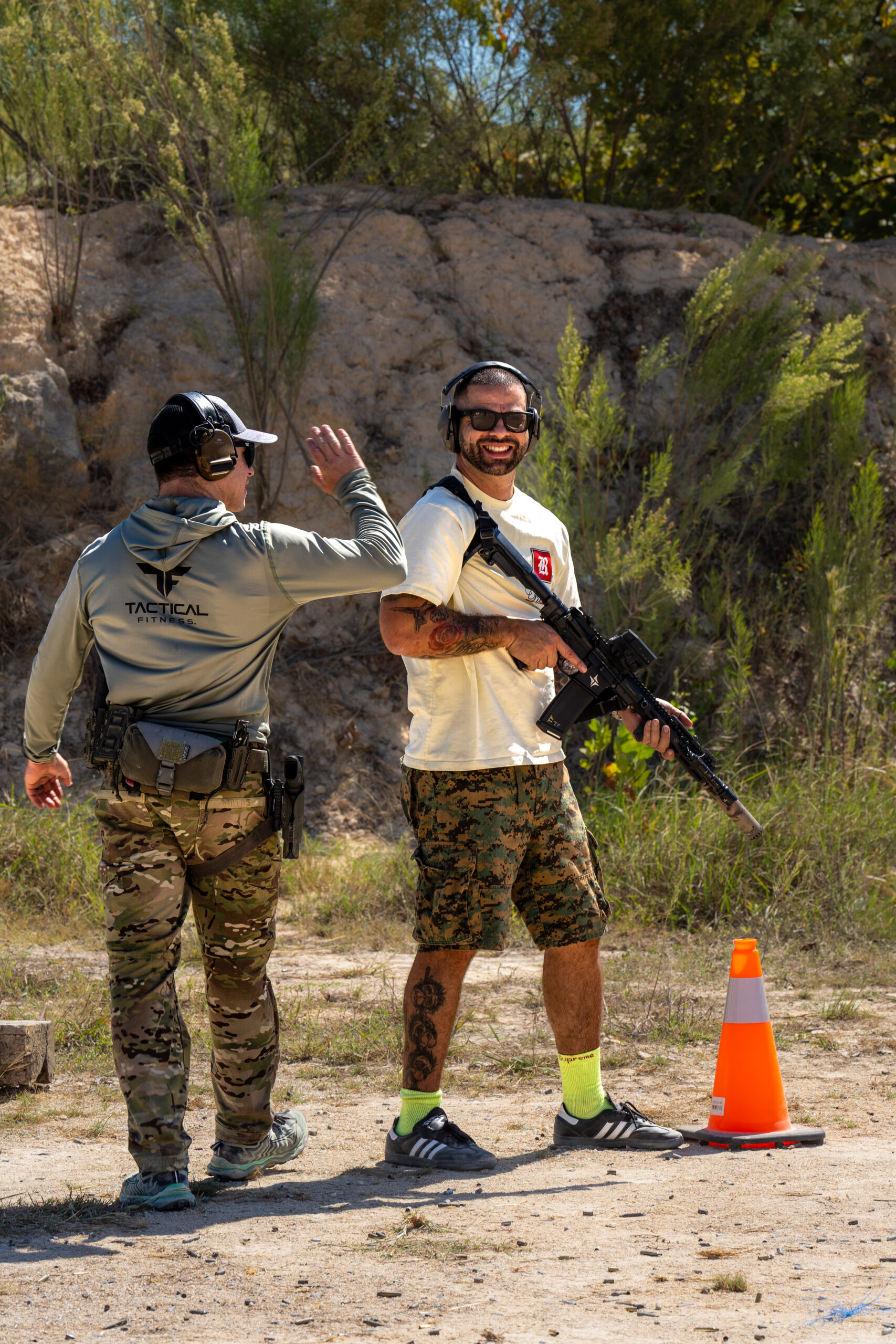 Instructor high five with first time shooter