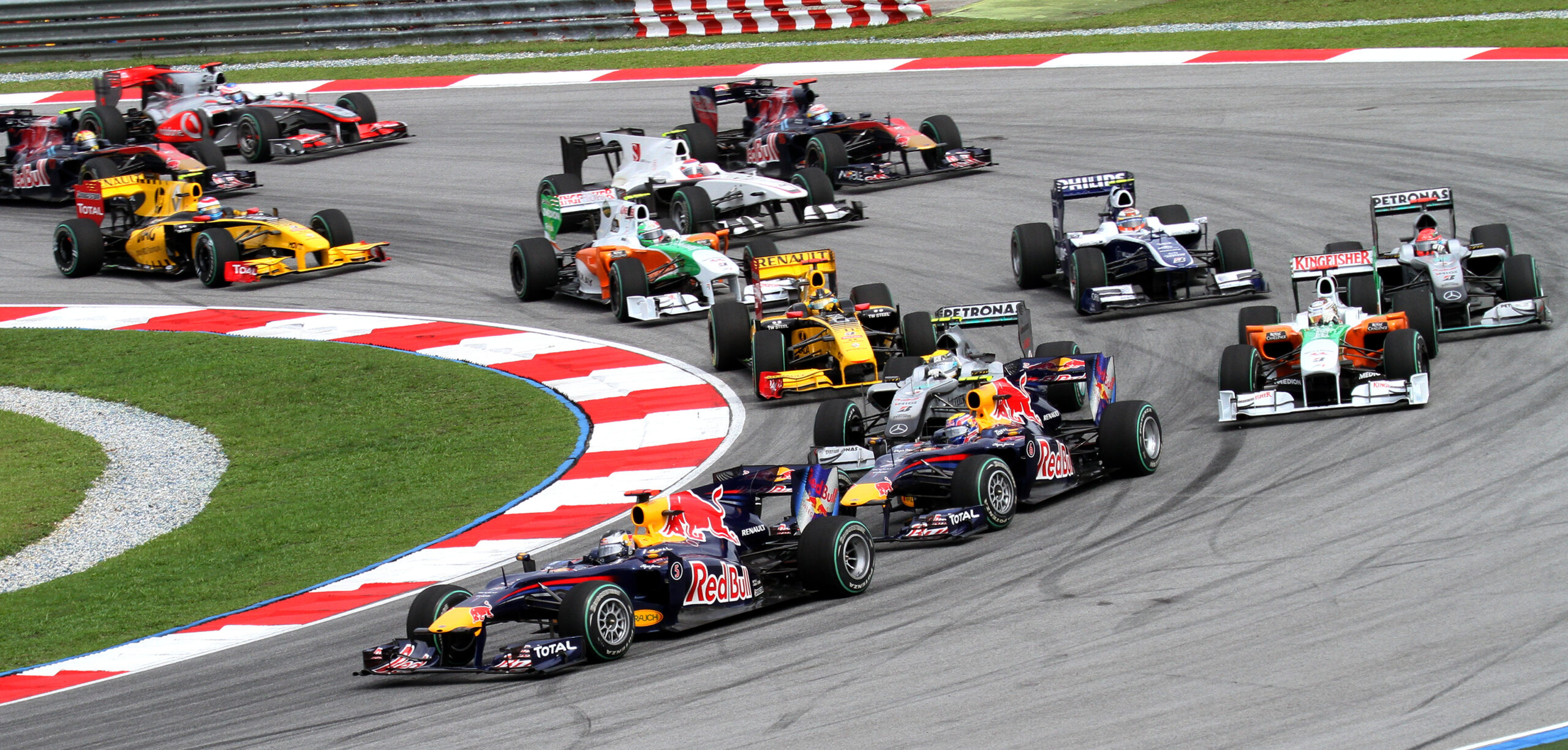 Formula 1 cars racing on the opening lap